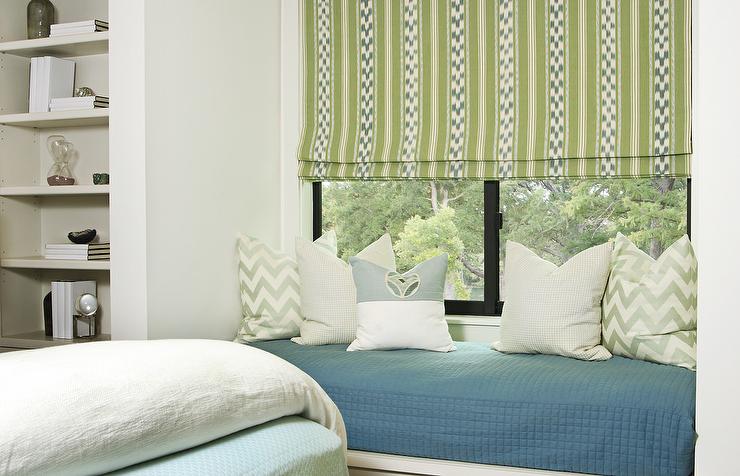 green-and-blue-boys-bedroom-built-in-window-seat-between-bookcases