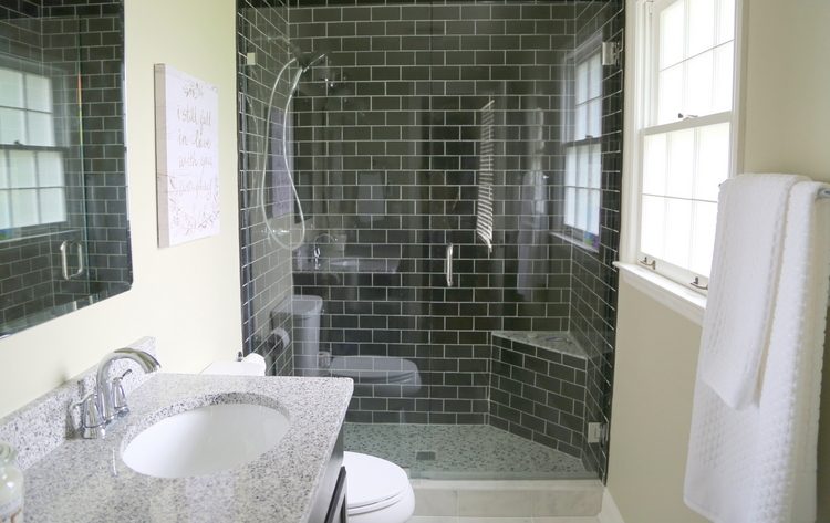 black subway tile bathroom design