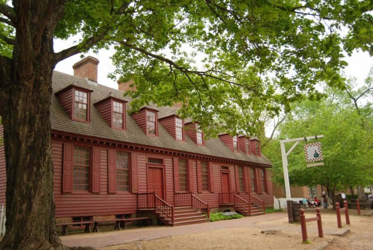 red trim with red shutters on red siding exterior of building