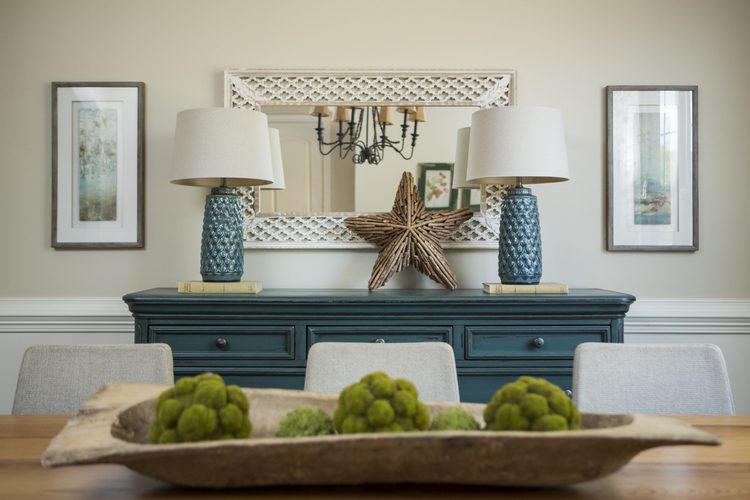 home staging training with The Decorologist, blue sideboard with pair of blue ceramic lamps, dough bowl with moss balls on transitional dining table