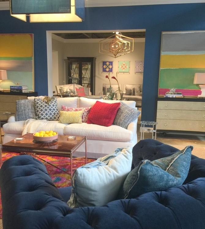 Universal Furniture showroom featuring royal blue sofa and walls