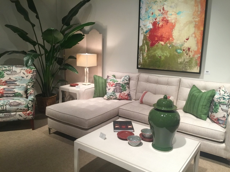 dark green decor with white sofa and ottoman at century furniture showroom