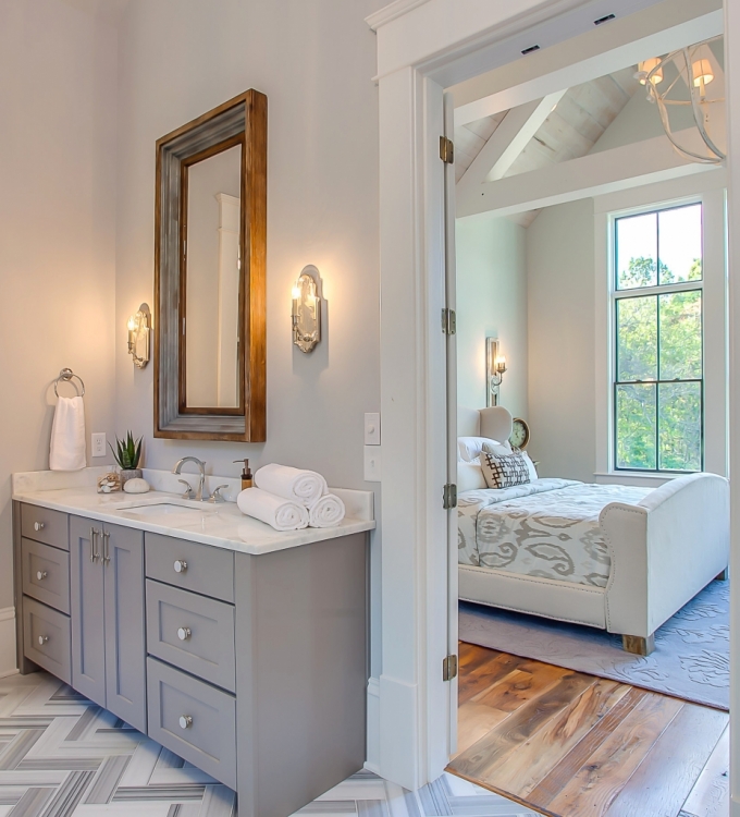 dark gray vanity and light gray walls in master bathroom