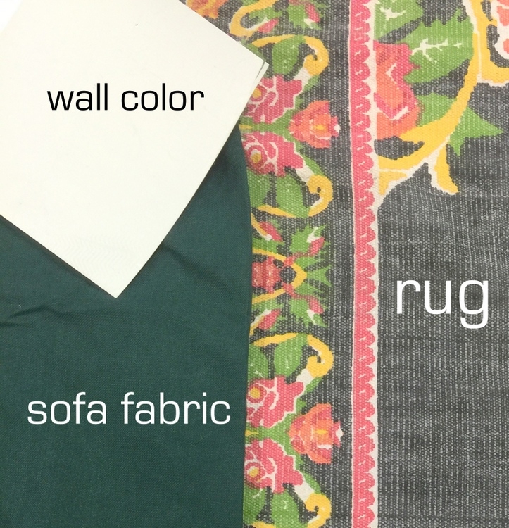 matching colors of a rug with wall and sofa colors