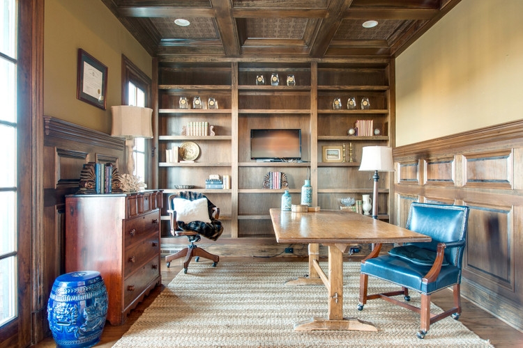 staged office with wood paneling and coffered ceiling