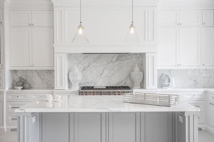 statuary marble countertops and backsplash in white kitchen