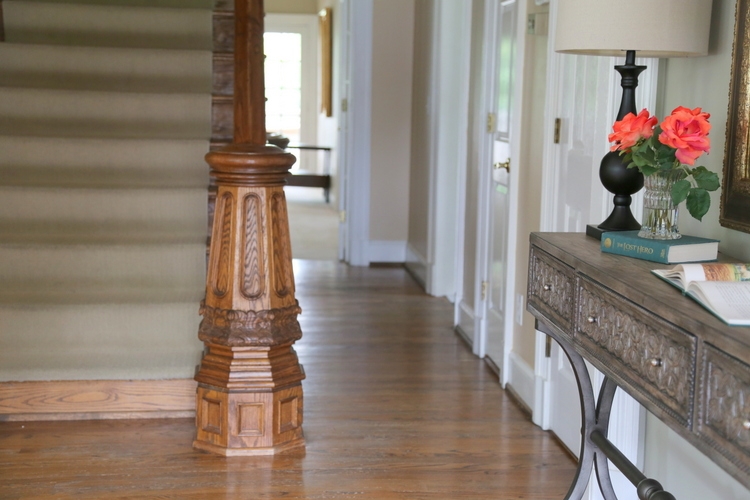 antique newel post detail in historic home
