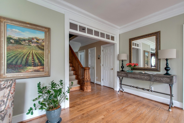 antique newel post and transom windows in historic home