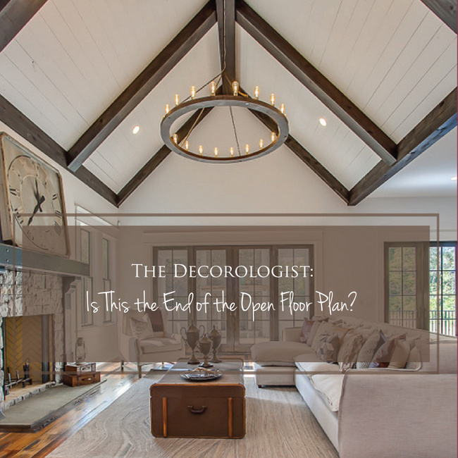 white room with dark beams and plank ceiling