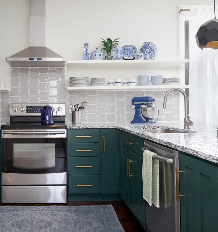 green lower cabinets and open shelving in kitchen design by The Decorologist