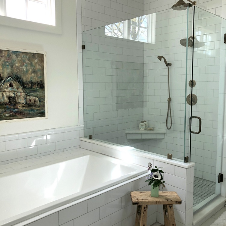 glass shower enclosure, soaking tub, and subway tile continue to be 2019 decorating trends