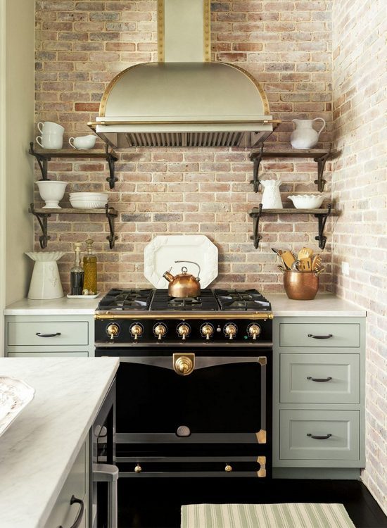 statement stove with brick wall and white ironstone kitchen photo styling