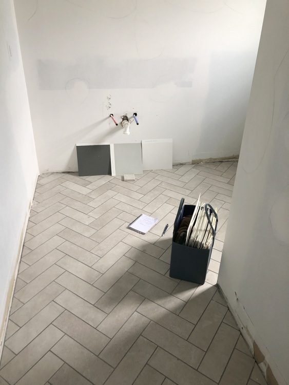 Elegant Gray Herringbone Floor in Bathroom