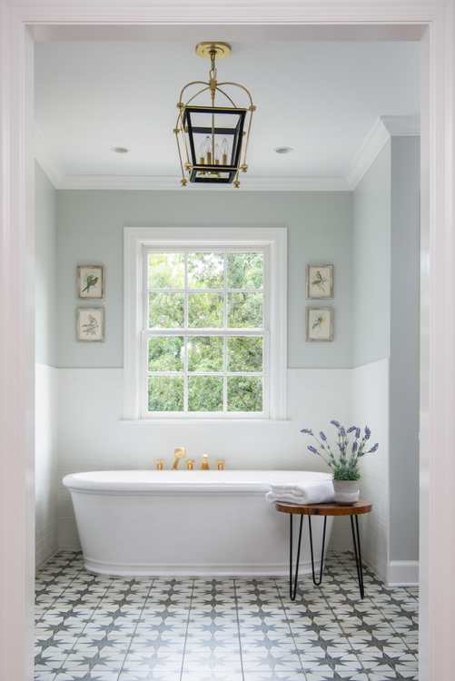 free standing tub in classic bathroom by The Decorologist