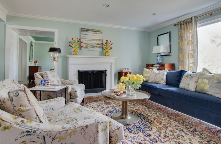 navy sofa and oriental rug in living room makeover