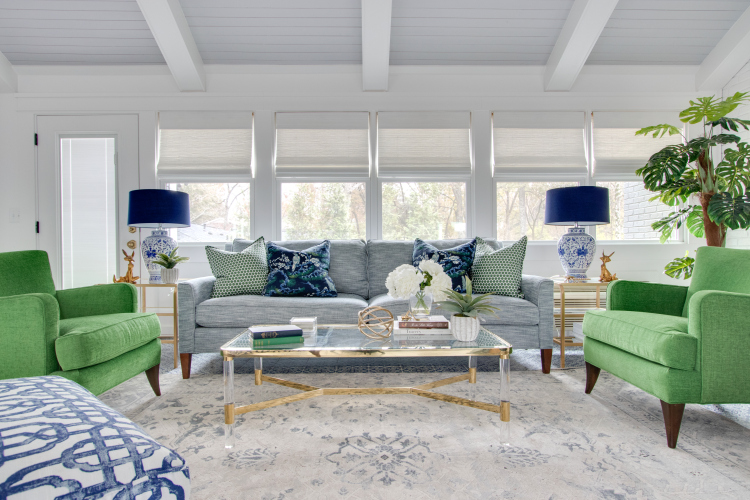 blue cr laine sofa and green art deco chairs