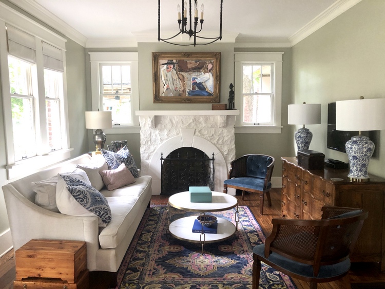 gray green living room with white fireplace