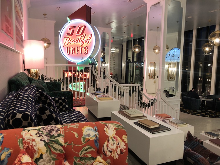 vintage sofas on tiered theatre-styled lobby