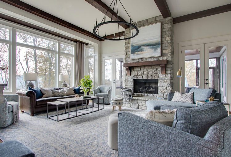 wood ceiling beams and stone fireplace