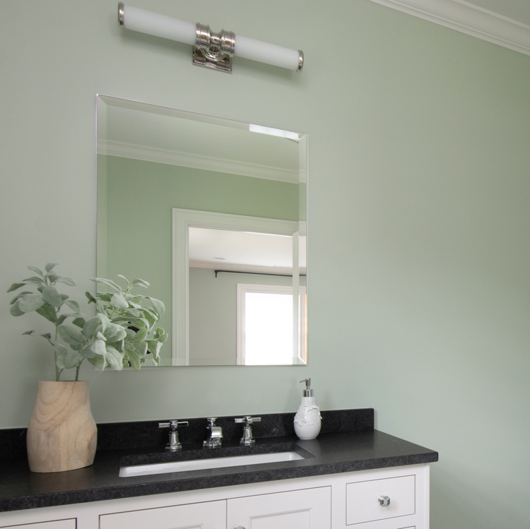 modern bathroom design with light green paint by the decorologist