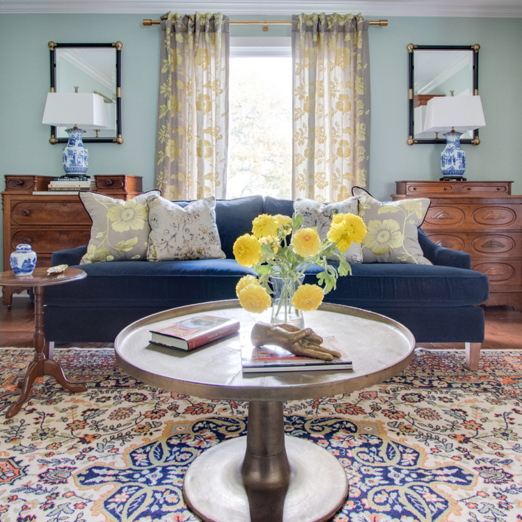 nashville living room design with navy sofa and chinoiserie lamps