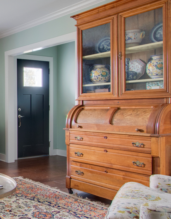 antique cabinet with black door