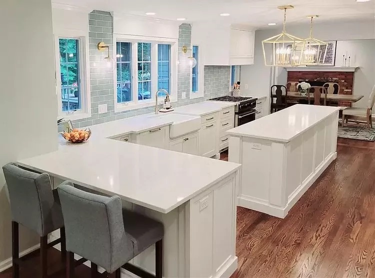 white kitchen with blue subway tile