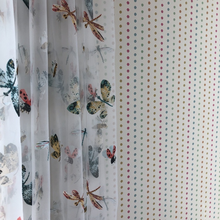 butterfly curtains and polka dot wallpaper